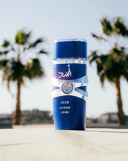 Bundle of Lattafa Perfumes Asad Zanzibar 3.4oz Eau De Perfume with 1 Travel Refillable Bottle(5ML) & 1 Scented Car Freshener Card