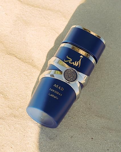 Bundle of Lattafa Perfumes Asad Zanzibar 3.4oz Eau De Perfume with 1 Travel Refillable Bottle(5ML) & 1 Scented Car Freshener Card